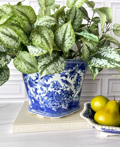 Chinoiserie bird and floral planter styled with greenery.