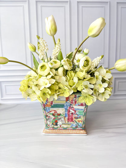 Square rose medallion porcelain planter in pink, green, blue, and yellow, styled with a lush floral arrangement for display.