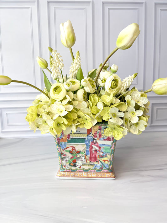Square rose medallion porcelain planter in pink, green, blue, and yellow, styled with a lush floral arrangement for display.