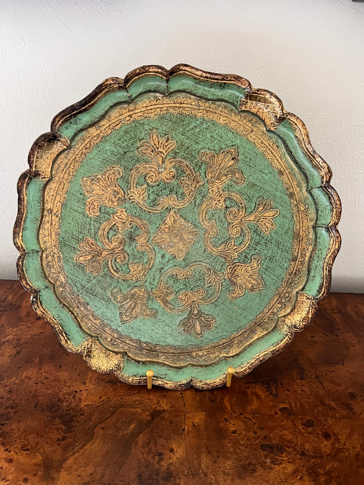 Green and gold Italian Florentine gilt wood tray with ornate raised design and scalloped edge.