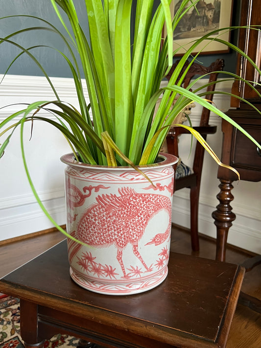 A beautifully detailed red peacock porcelain cachepot with classic chinoiserie motifs. Perfect for florals, orchids, or decorative styling.
