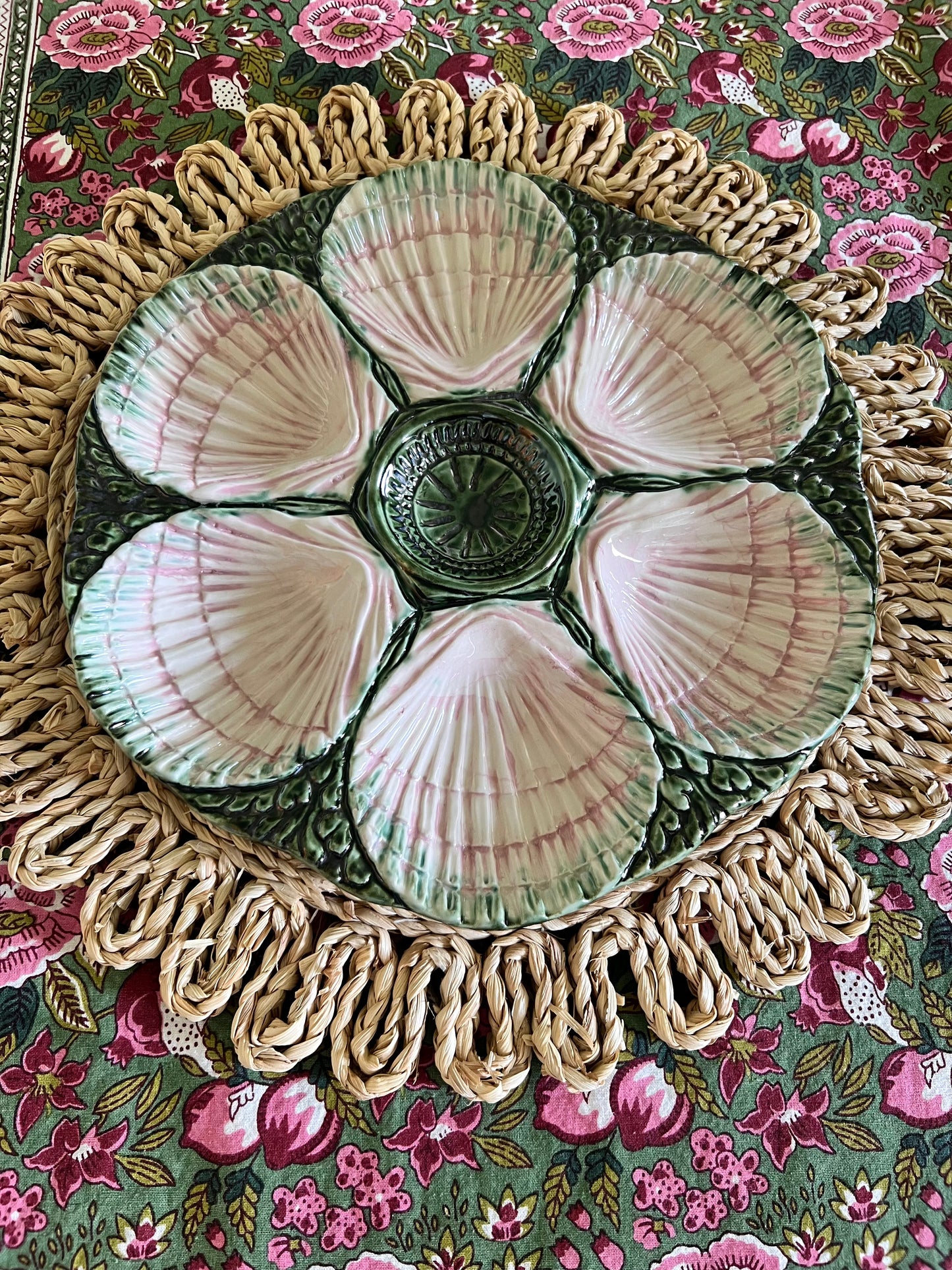 Hand-painted pink and green Portuguese oyster plate with six sculpted shell wells and dimensional green majolica-style detailing.