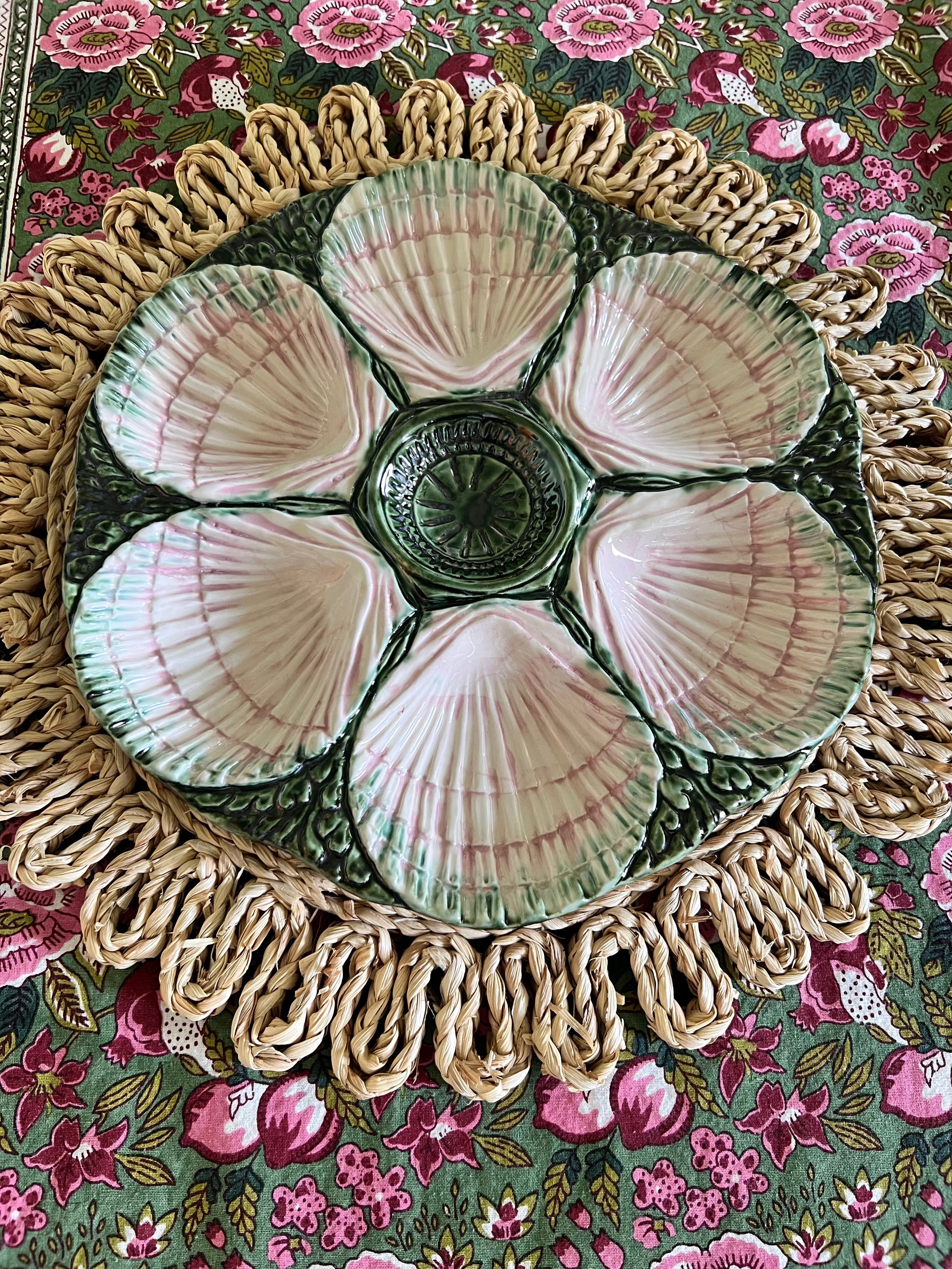 Hand-painted pink and green Portuguese oyster plate with six sculpted shell wells and dimensional green majolica-style detailing.