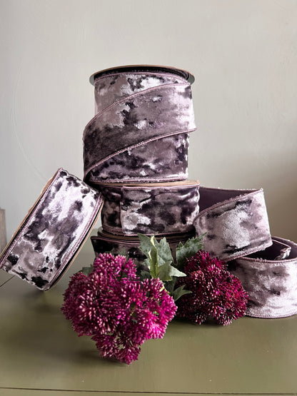 Silver lavender plum crushed velvet wired designer ribbon, 2.5 inches wide, displayed on stacked rolls with cascading loops and deep plum flowers.