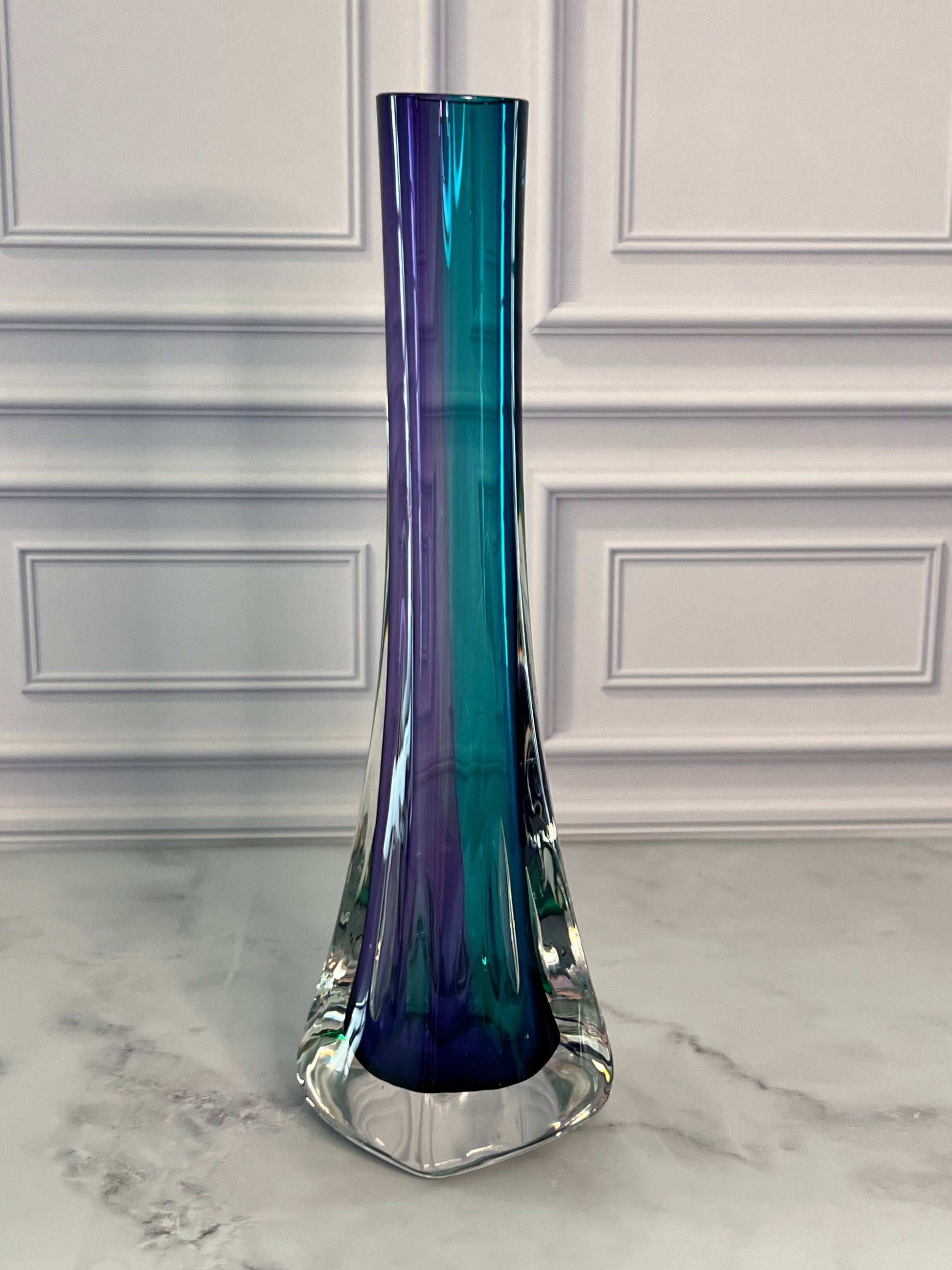 Signed Grant 10-inch Sommerso art glass bud vase featuring a solid cased design with triple-layer amethyst, blue, and green colors.